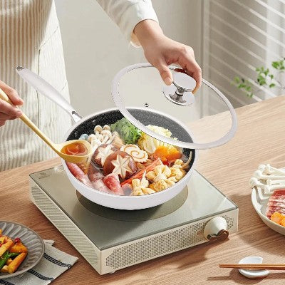 poele_en_inox_de_haute_qualite sur plaque induction cuisson legumes