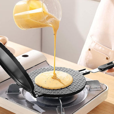 crepiere en aluminium 16 cm sur gaz avec pate qui coule sur la crepiere