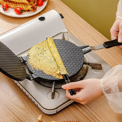 crepiere pour gauffres aussi avec une gauffre en cuisson enroulee autour de deux baguettes